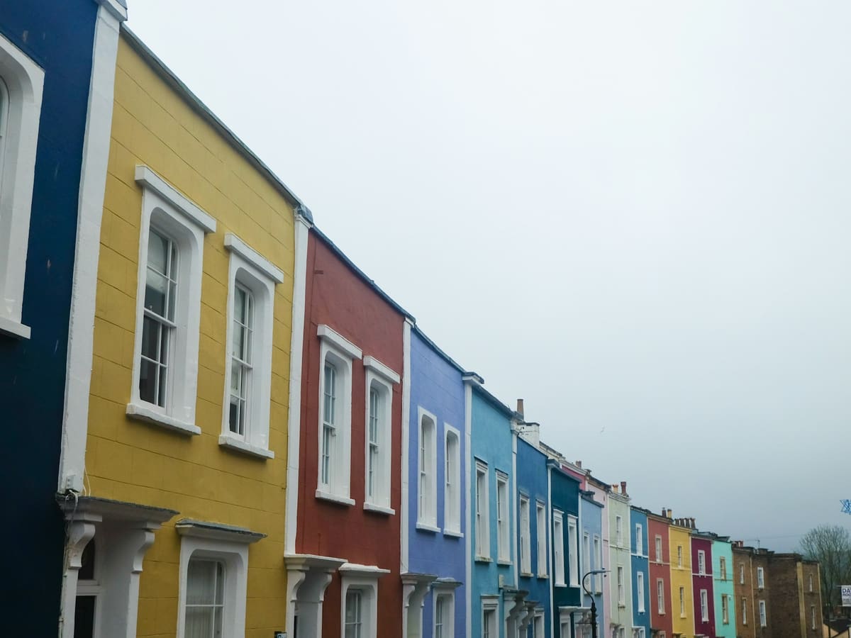 a row of colorful houses on a street