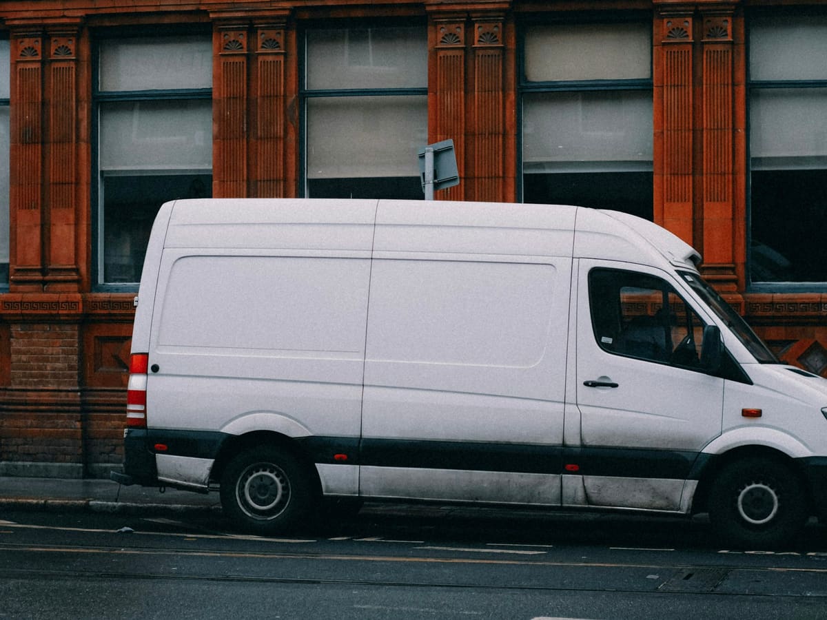 a white van parked on the side of the road